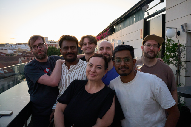WunderGraph team members on a Madrid rooftop at sunset